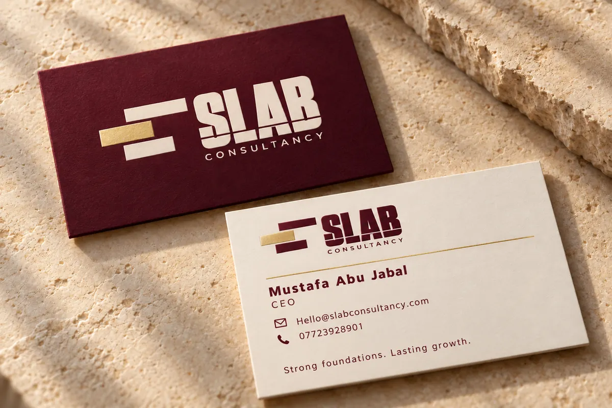 Slab Consultancy business cards in burgundy and ivory with a gold block in the logo